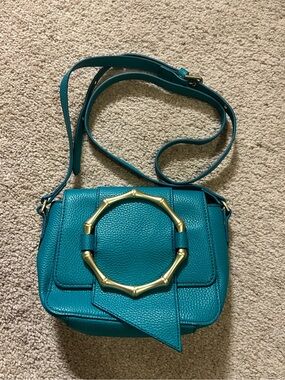 Foley + Corinna Joni teal crossbody bag with distinctive bamboo detail